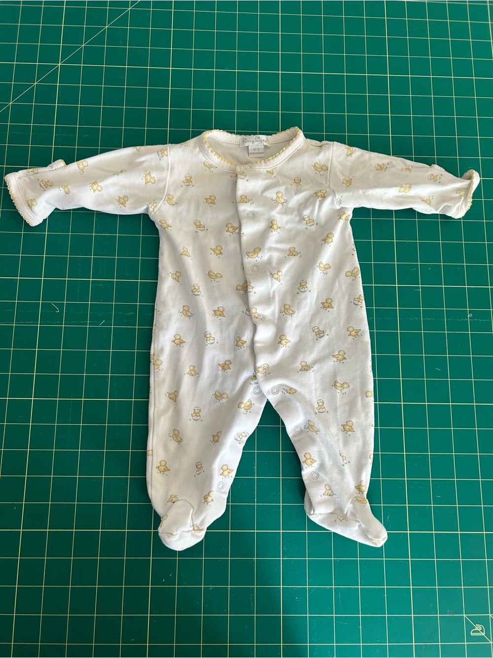 Kissy Kissy Footed One-Piece Sleeper in White with Yellow Duck Print